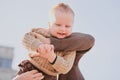 Parents play with their child close-up. Boy flying and laughing, happy family Royalty Free Stock Photo