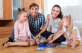 Parents playing lotto with kids Royalty Free Stock Photo