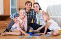 Parents playing lotto with kids Royalty Free Stock Photo