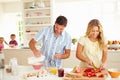 Parents Preparing Family Breakfast In Kitchen Royalty Free Stock Photo