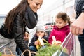 Parents pushing shopping cart with groceries and their daughters Royalty Free Stock Photo