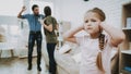 Parents Quarrel Unhappy Child Closes Ears in House Royalty Free Stock Photo