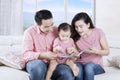 Parents reading story to child Royalty Free Stock Photo