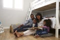 Parents Reading Story To Children In Their Bedroom Royalty Free Stock Photo