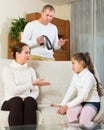 Parents scolding daughter at home Royalty Free Stock Photo