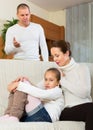 Parents scolding daughter at home Royalty Free Stock Photo