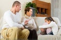 Parents scolding daughter at home Royalty Free Stock Photo