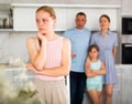 Parents scolding teenager daughter in kitchen Royalty Free Stock Photo