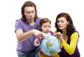 Parents show something on ball-earth to daughter Royalty Free Stock Photo