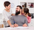 Parents signing property papers Royalty Free Stock Photo