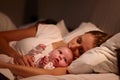 Parents Sleeping In Bed With Newborn Baby Royalty Free Stock Photo