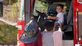 Parents take pictures of kids exploring firetruck
