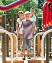 Parents with teenager overcoming the obstacle course Royalty Free Stock Photo