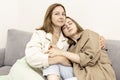 Parents and teens.Mom and teenage daughter are sitting on the couch. Conflict, difficult age. Family Royalty Free Stock Photo