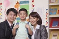 Parents with their Son in Classroom