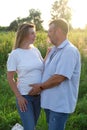 parents to be. happy couple husband and pregnant wife outside enjoying nature. dreams come true. charming adult family