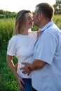 parents to be. happy couple husband and pregnant wife outside enjoying nature. dreams come true. charming adult family