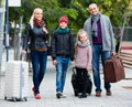 Parents with two kids chasing streets