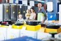 parents with two kids choosing kitchenware in home appliance store Royalty Free Stock Photo