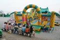 Parents are waiting for children playing an inflatable attraction