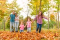 Parents walk in the park with little girls Royalty Free Stock Photo