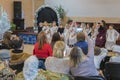 parents are watching the performance children in kindergarten. A children's holiday in the kindergarten. blurry