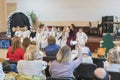 parents are watching the performance children in kindergarten. A children's holiday in the kindergarten. blurry