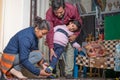 Parents wearing shoes to their child