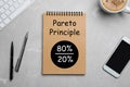 Pareto principle. Notebook with 80/20 rule representation on marble table, flat lay