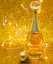 parfume Dior gold bokeh background bolls glitter