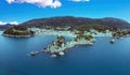 Parga Greece Epirus. Aerial drone view of coastal city Panagia islet blue afternoon sky background Royalty Free Stock Photo