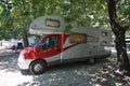 Parga, Greece, July 12 2018, A camper parked under the shadow of the plane trees