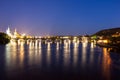 Pargue charles bridge by night reflections river moving lights Royalty Free Stock Photo