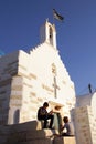 Parikia, Greece, September 16 2018, Greek children play near the church of Agios Konstantinou, a traditional Cycladic church