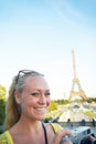 Paris is amazing. Portrait of a beautiful young woman taking photos while sight seeing in the Paris. Royalty Free Stock Photo