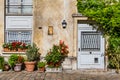 Paris apartment door surrounded by red flowers Royalty Free Stock Photo