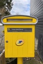 PARIS - APRIL 11, 2021: Yellow postbox of La Poste in Paris, France