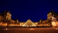 PARIS - AUG 8 : Louvre museum at twilight in summer on August 15 Royalty Free Stock Photo