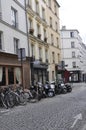 Paris,august 19,2013-Street in Montmartre with parking for motors and bicycle in Paris