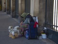 Paris beggar woman and her small white dog