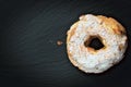 Paris Brest Famous French dessert sweet round pastry in the form of a wheel on black slate plate