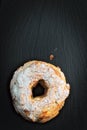 Paris Brest Famous French dessert sweet round pastry in the form of a wheel on black slate plate