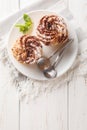 Paris-Brest is a French dessert made of choux pastry and a praline flavoured cream closeup on a plate. Vertical top view Royalty Free Stock Photo