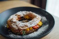 Paris brest stuffed with peaches, strawberries and rosemary