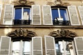 Paris building facades with white shutters