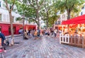 PARIS - CIRCA JUNE, 2014: Tourists in beautiful streets of Montmartre