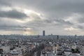 Paris Cityscape With Montparnasse Tower And Dark Cloudy Sky