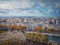 Paris cityscape over the Seine river, view from the Eiffel tower height, France. Fall season scene with colorful yellow trees Royalty Free Stock Photo