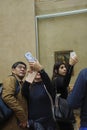 Visitors view and photograph the Mona Lisa Royalty Free Stock Photo