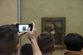 Visitors view and photograph the Mona Lisa Royalty Free Stock Photo